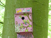 A picture of a bird box on a tree