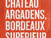 Wine of The Month - Chateau Argadens words on a red background