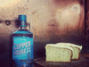 Adnams copper house gin with a slice of cake