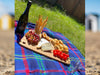 Adnams products on a picnic blanket