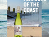 Bottle of The Den Wine on the beach