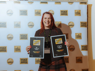 Sally holding the Adnams World Whiskies Awards 2026 