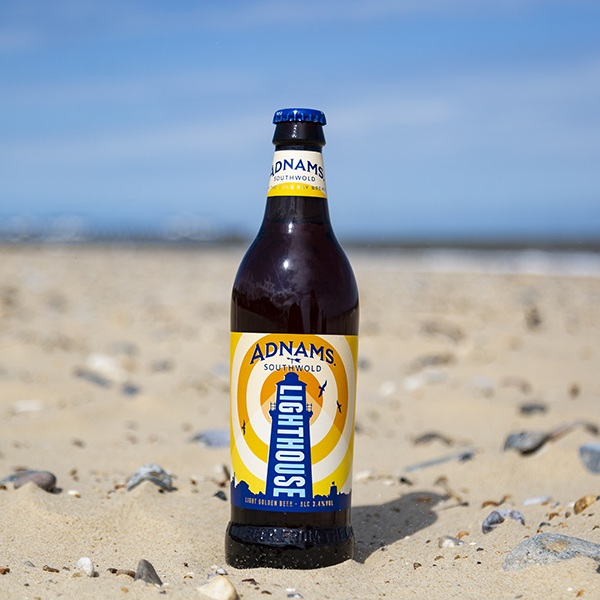 Bottle of Adnams Lighthouse Beer on the Beach.
